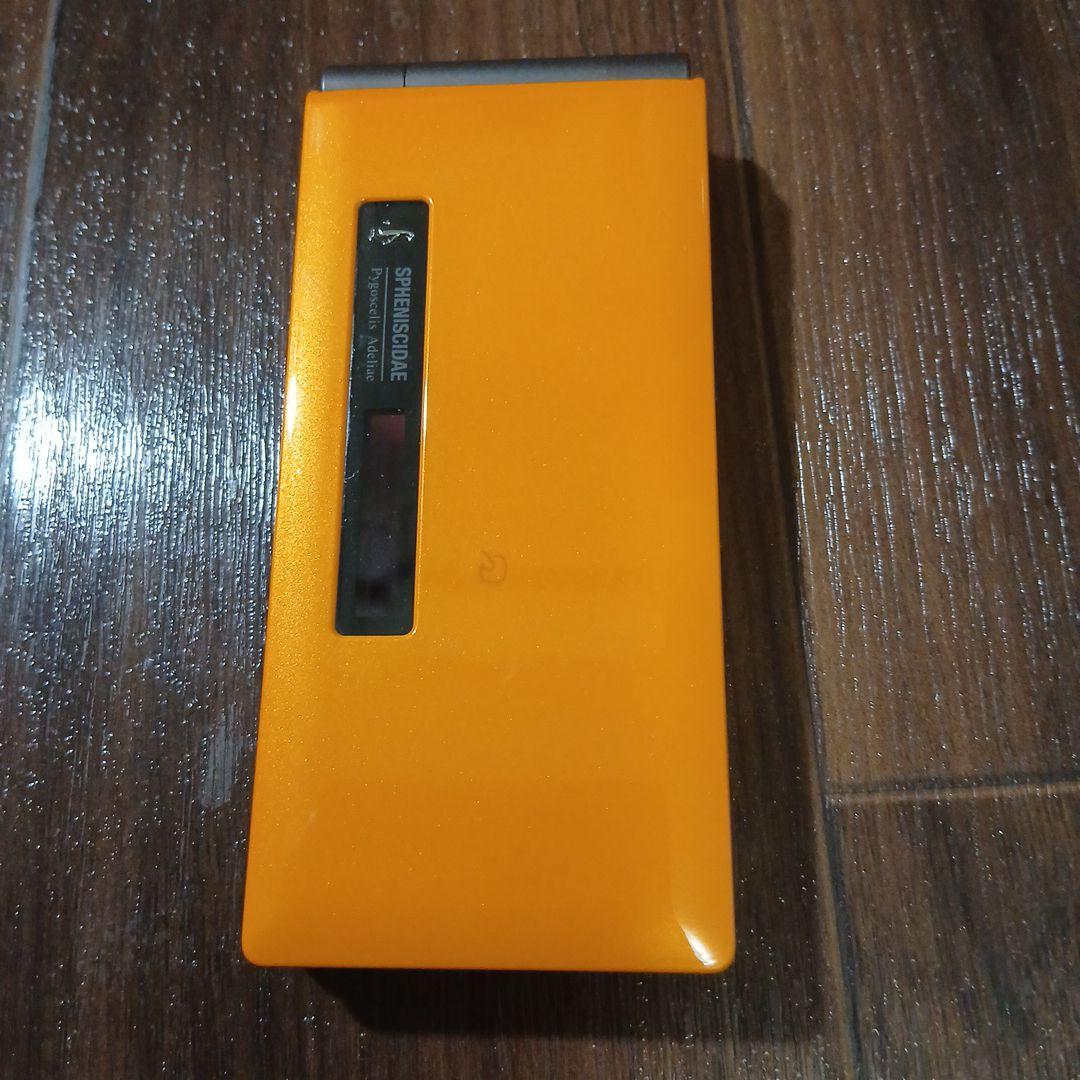 未使用オレンジ CA007 携帯電話本体
