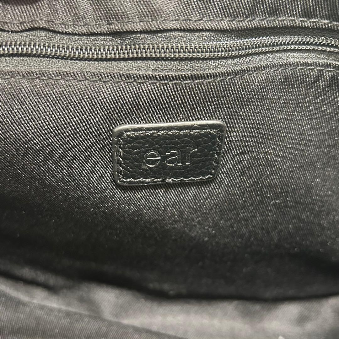 イアパピヨネ　ワイドテープショルダーバッグ　黒 編み込みデザイン