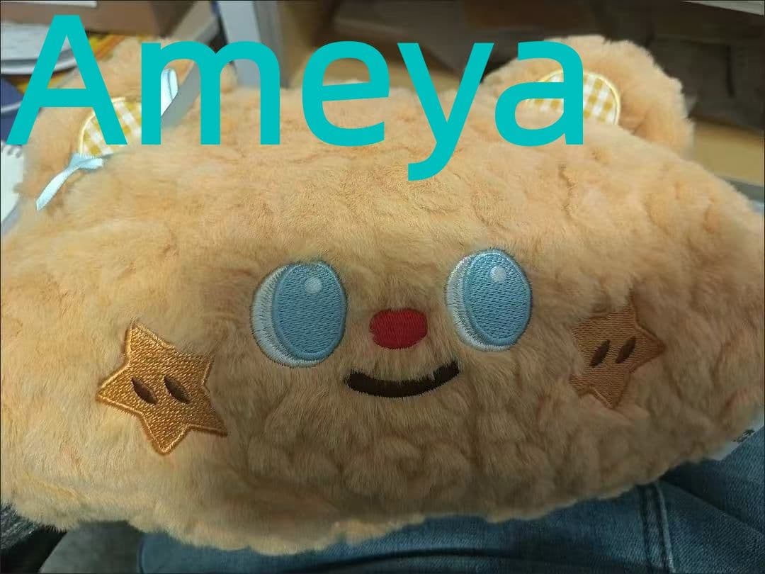 オレンジ色クマのぬいぐるみ