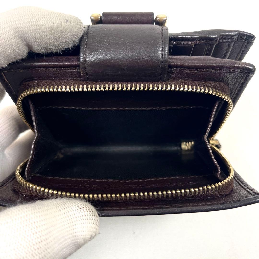 グッチ　二つ折り財布　アビー　シマレザー　ラウンドファスナー　ロゴ　エンボス