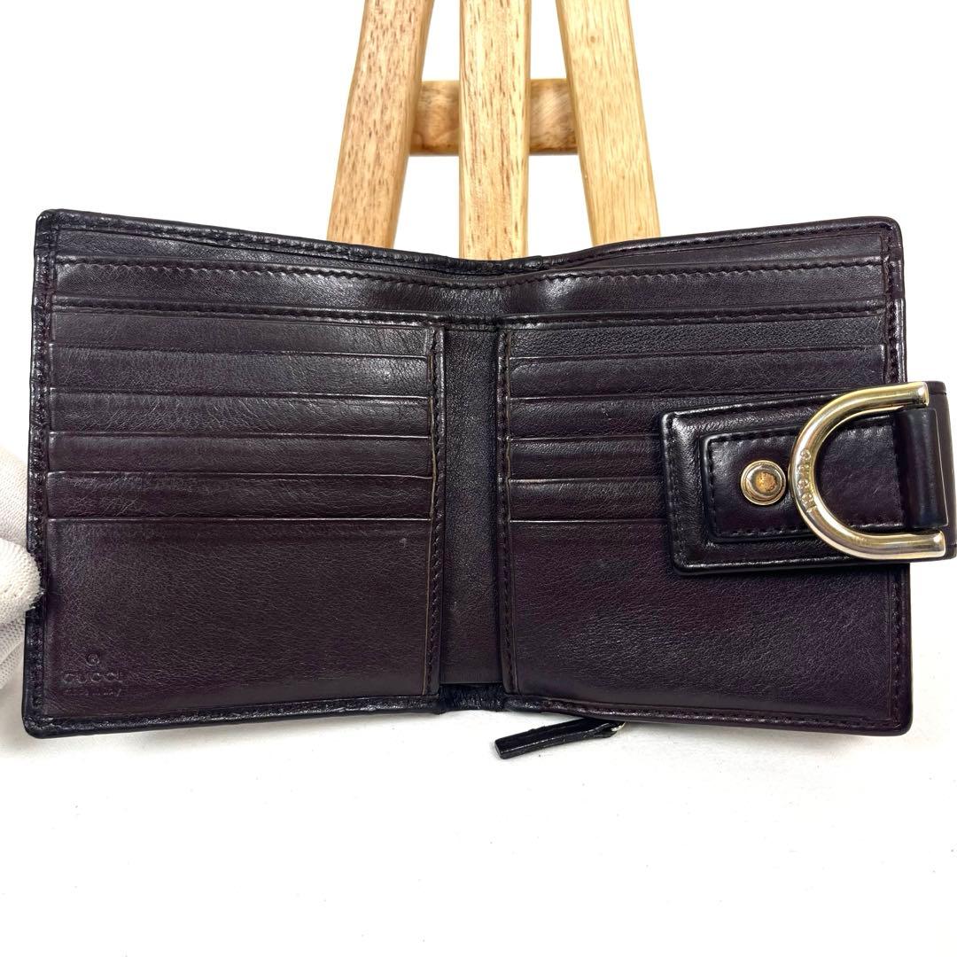 グッチ　二つ折り財布　アビー　シマレザー　ラウンドファスナー　ロゴ　エンボス