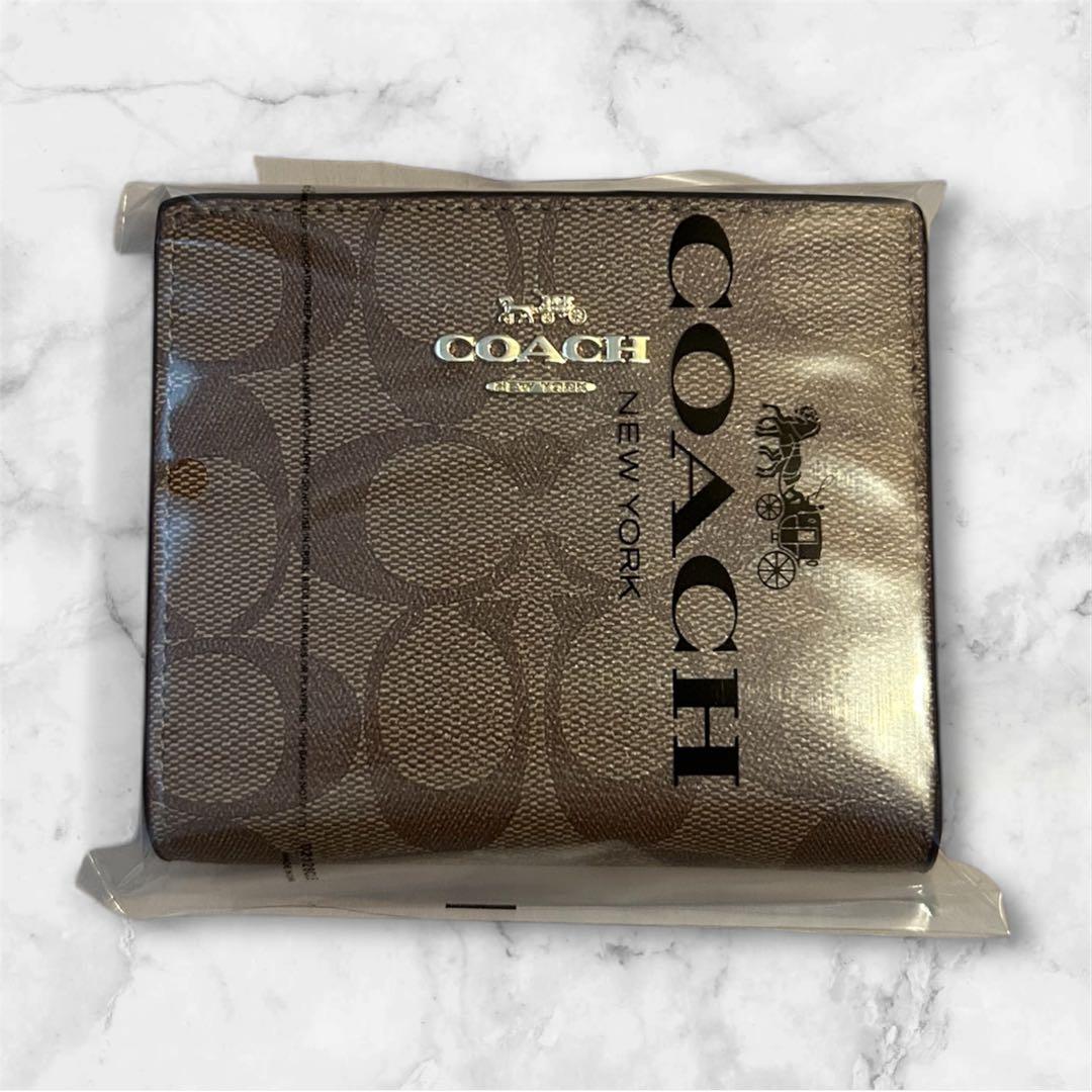 新品 COACH 二つ折財布 シグネチャー ラウンドファスナー ブラウン