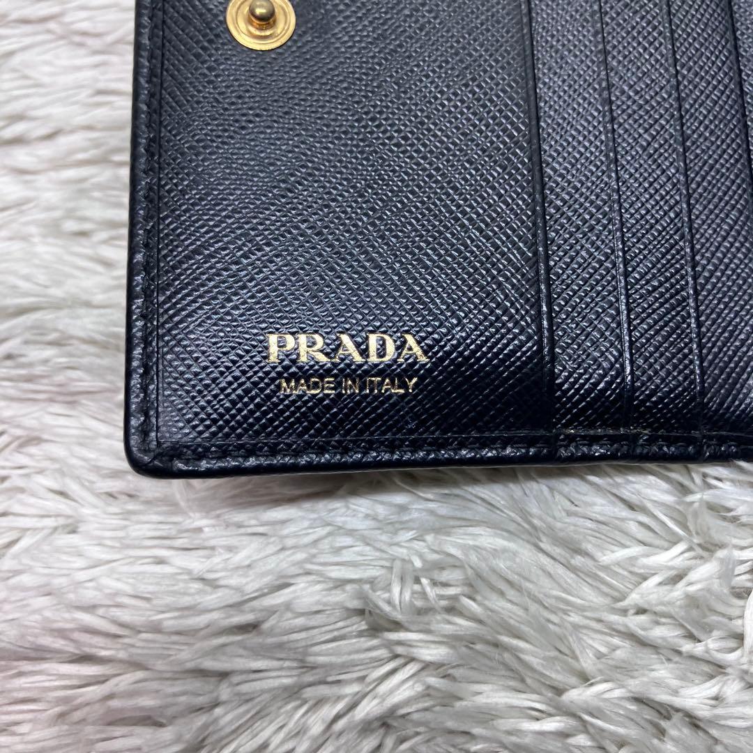 現行美品✨PRADA サフィアーノ メタルロゴ 二つ折り財布 フラップ ブラック