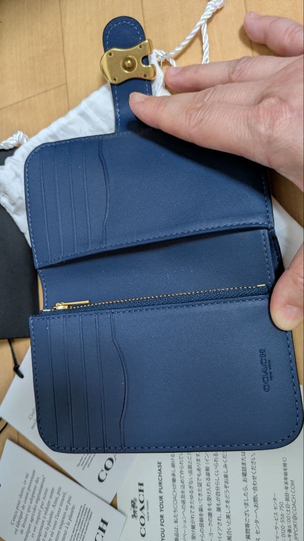 コーチ２つ折り財布タビー