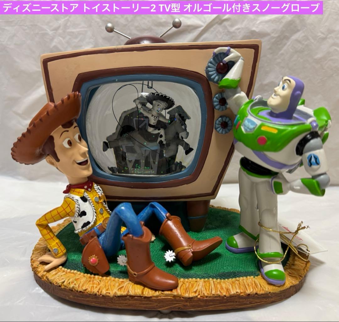 ディズニーストア トイストーリー2 TV型 オルゴール付きスノーグローブ