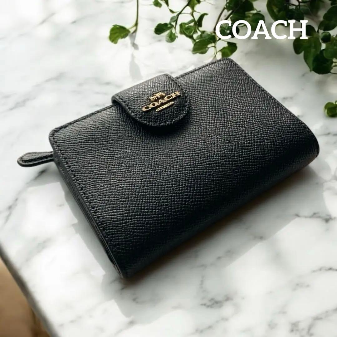 COACH コーチ　2つ折財布黒　ゴールド金具馬車ロゴ
