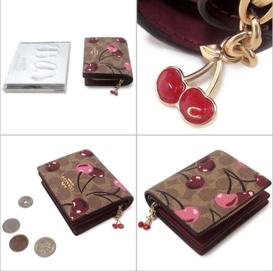 COACH シグネチャーチェリープリント二つ折り財布、さくらん