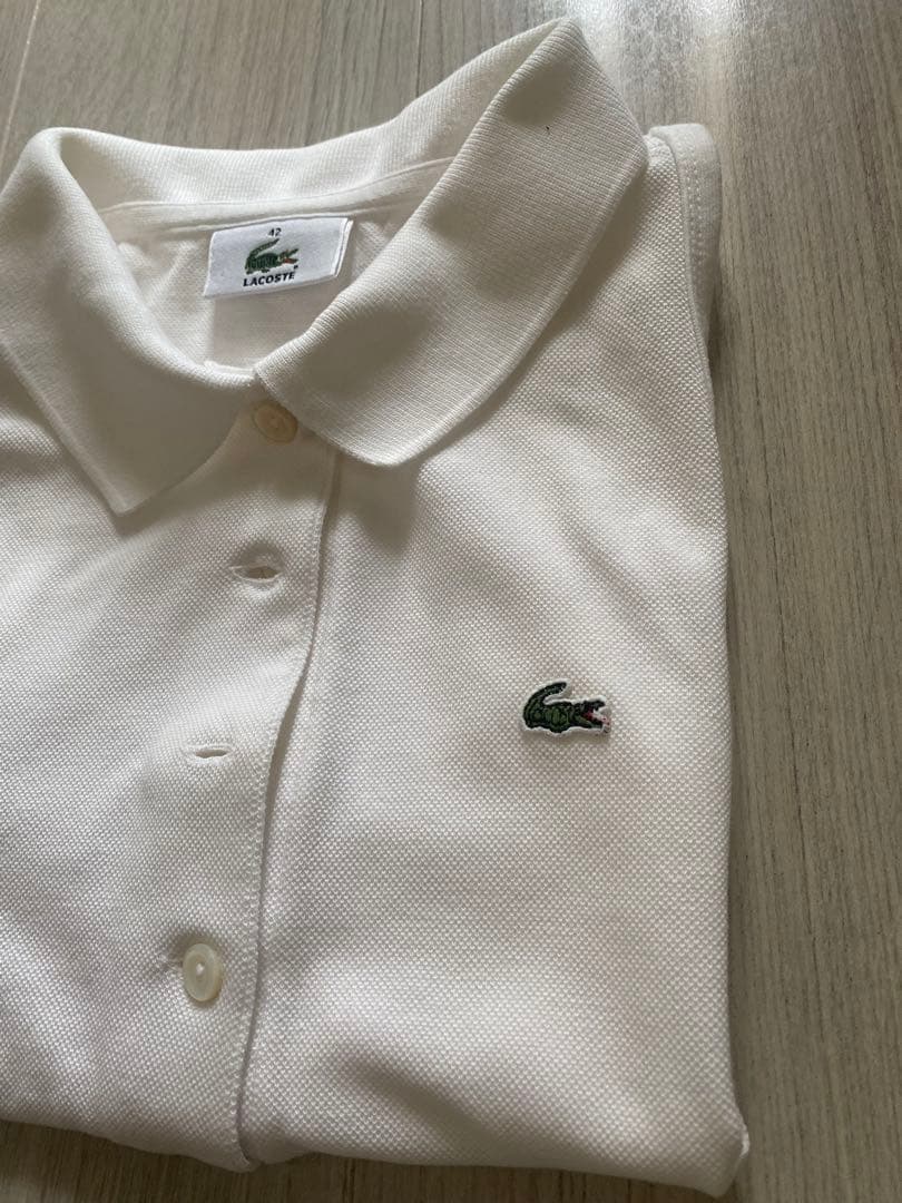 LACOSTE ホワイト ノースリーブポロシャツ