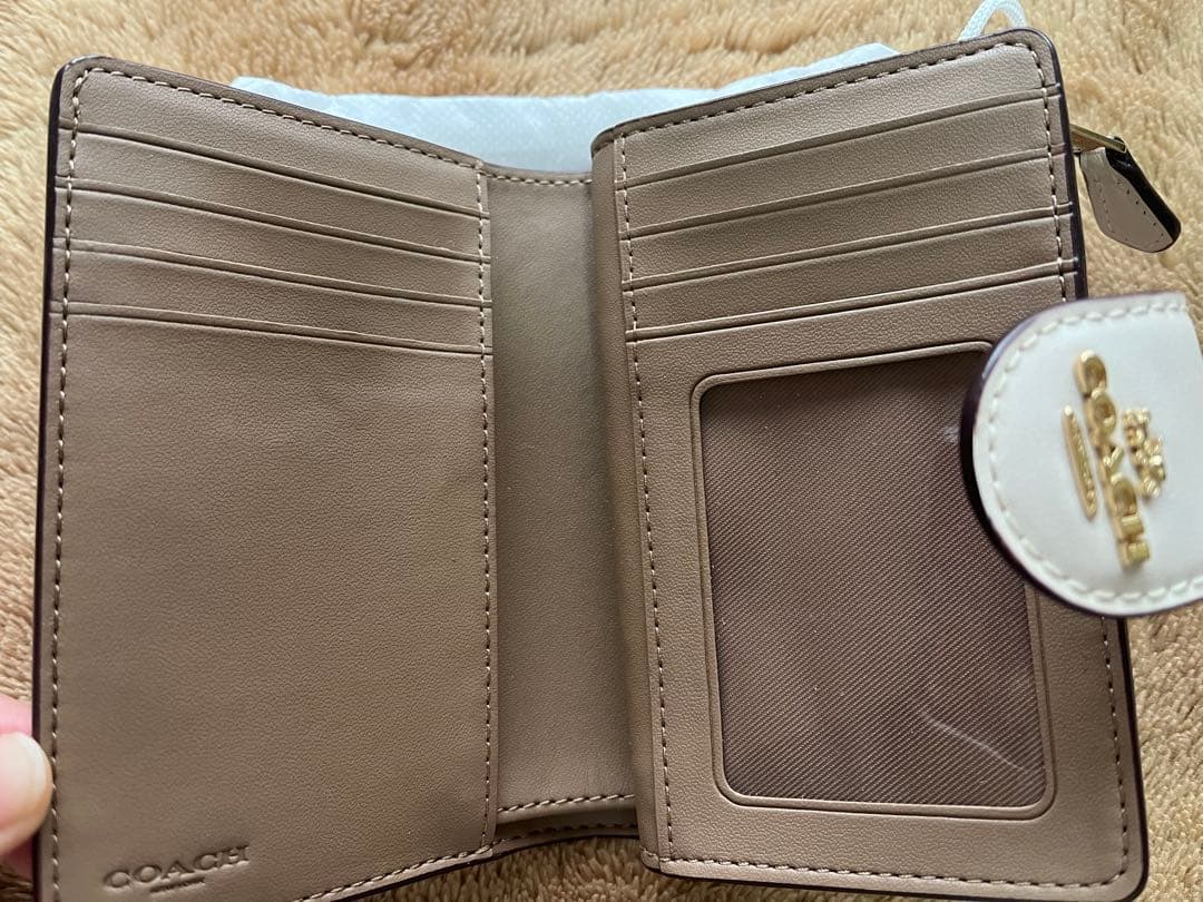 現状維持 COACH 二つ折り財布 ベージュ