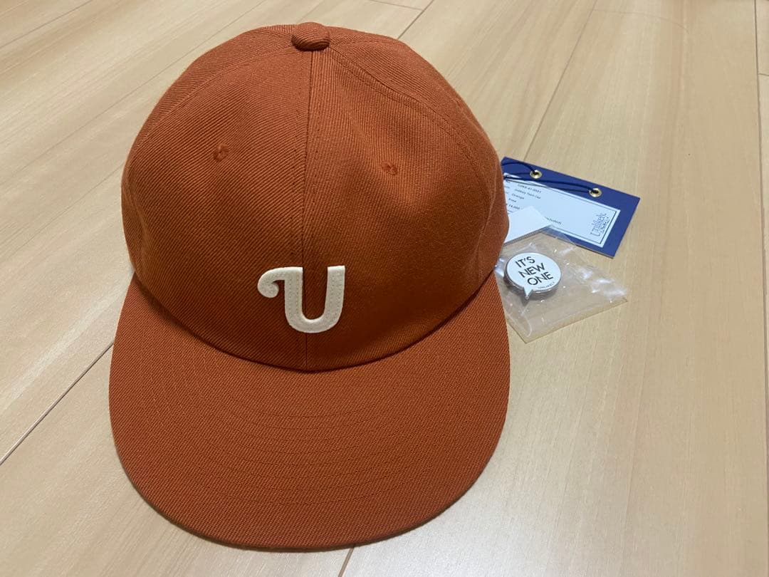 unlikely team cap オレンジ 26ss