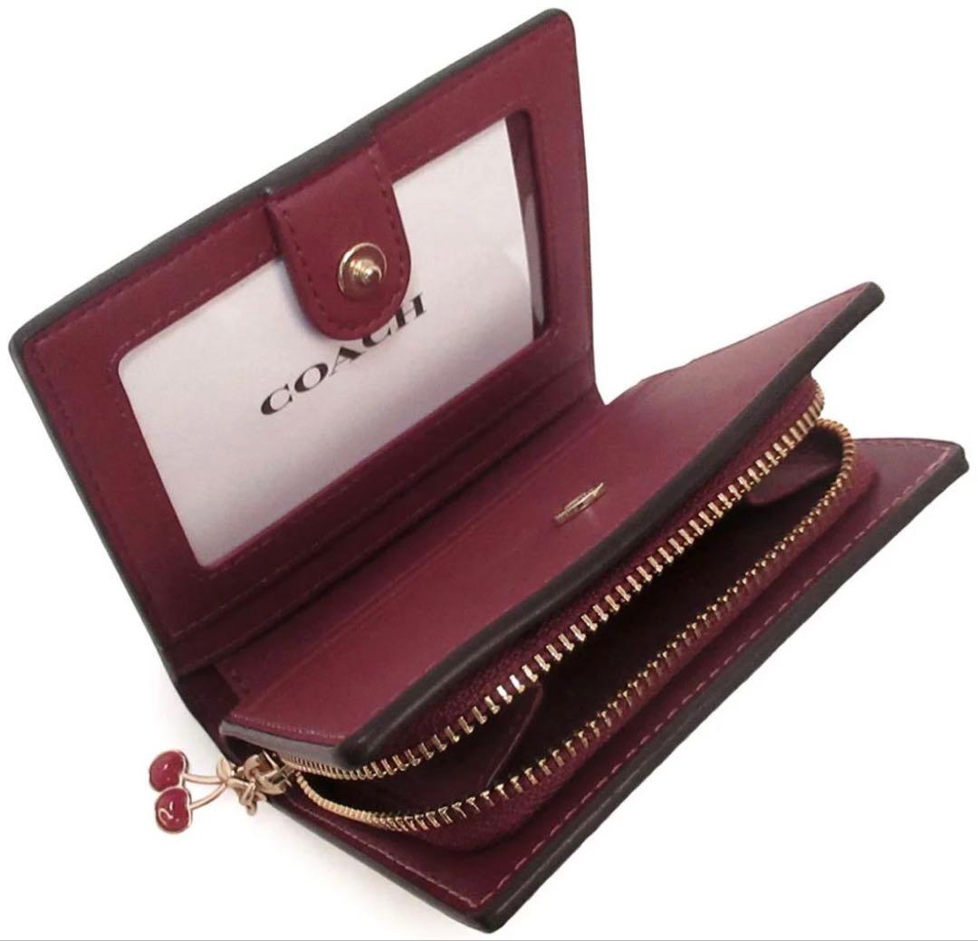 coachコーチチェリープリントチェリープリントシグネチャースナップ二つ折り財布