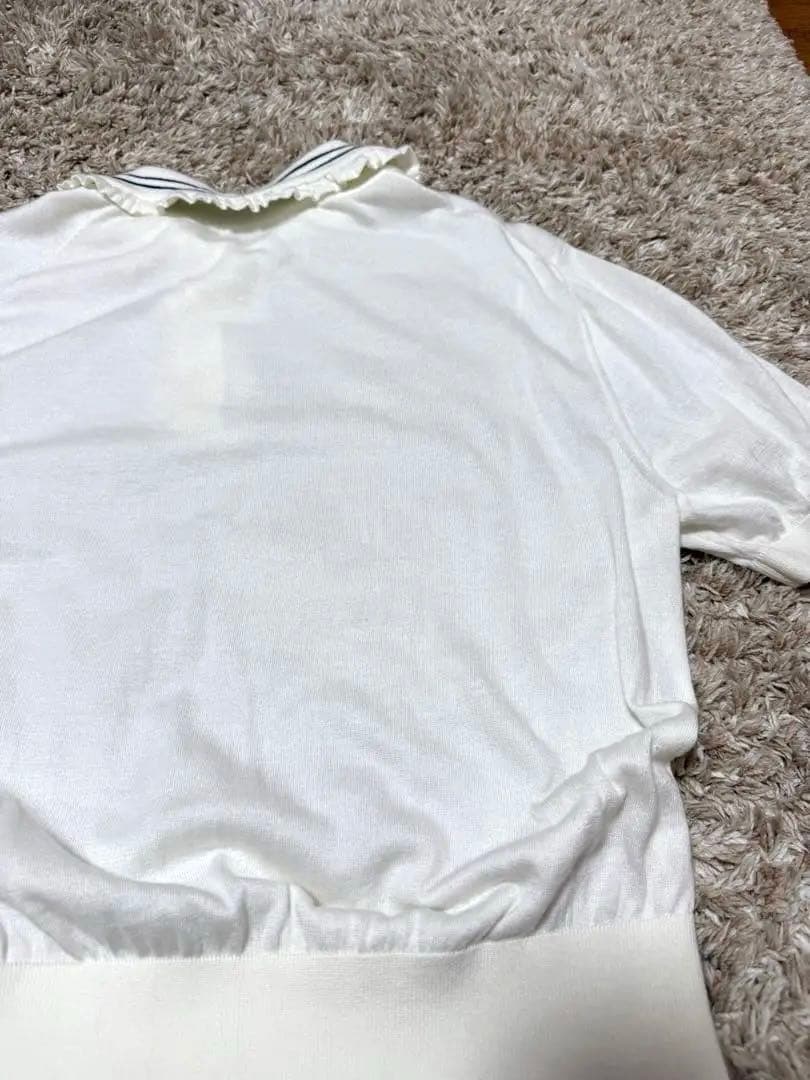 yori ミニフリルポロニット