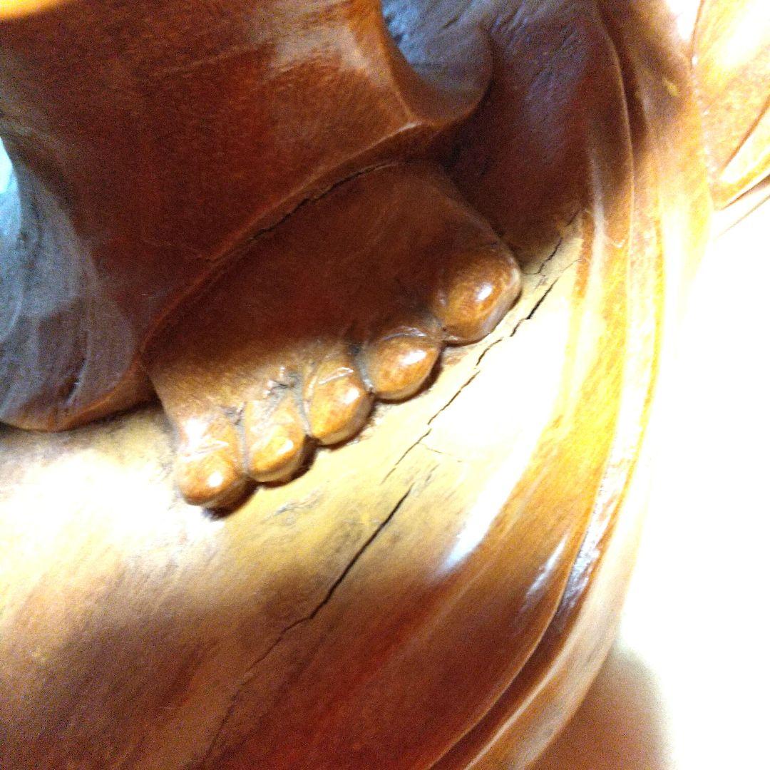 木製布袋の置物で一枚木彫りの高さ25cm長さ52cm幅15cm重さは約５キロです